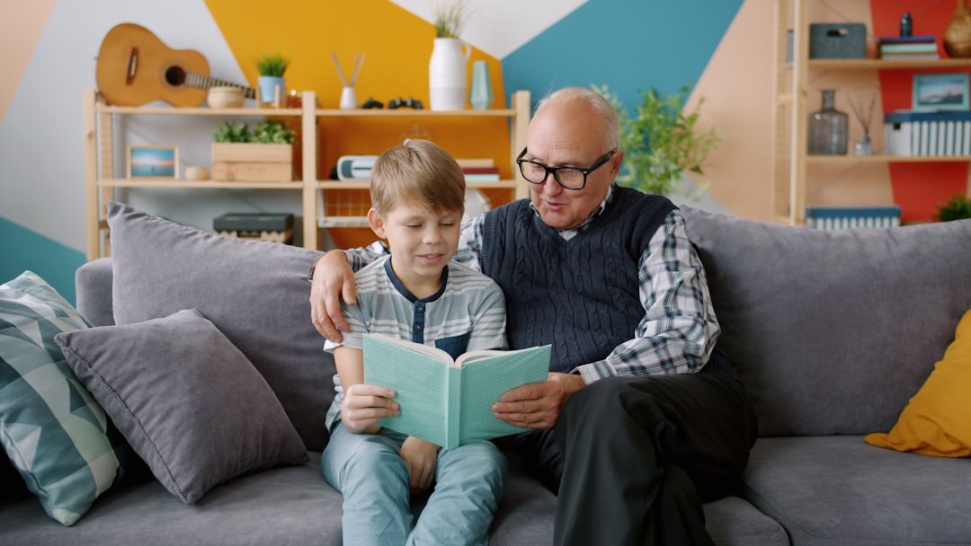 elderly man reading a book