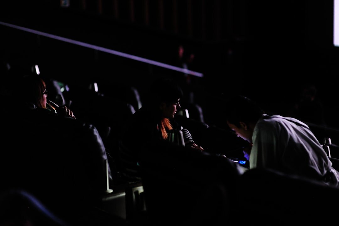Seniors sitting in a theatre audience and applauding