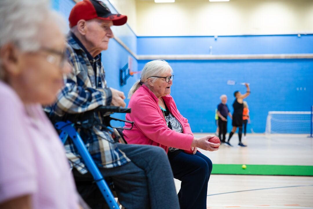 Group of seniors dancing together in a community hall