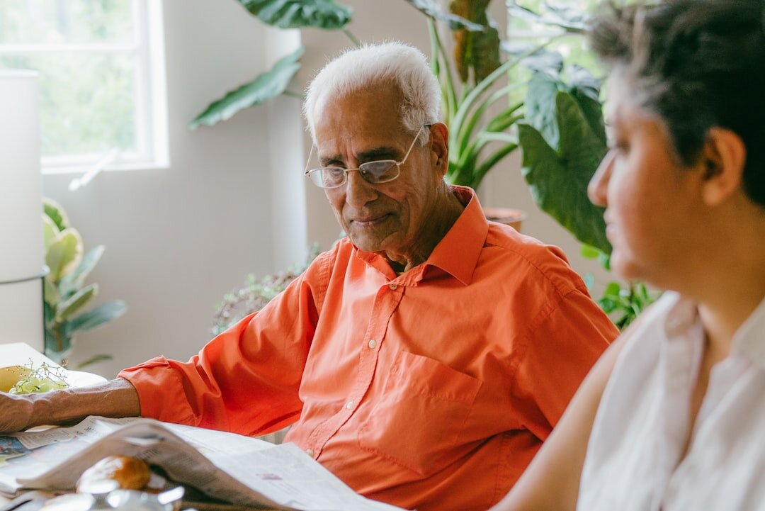 senior man paying bills