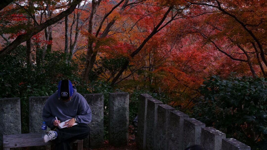 senior reading book in garden