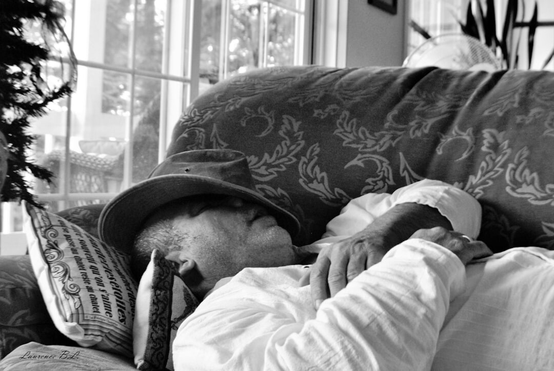elderly couple reading newspaper